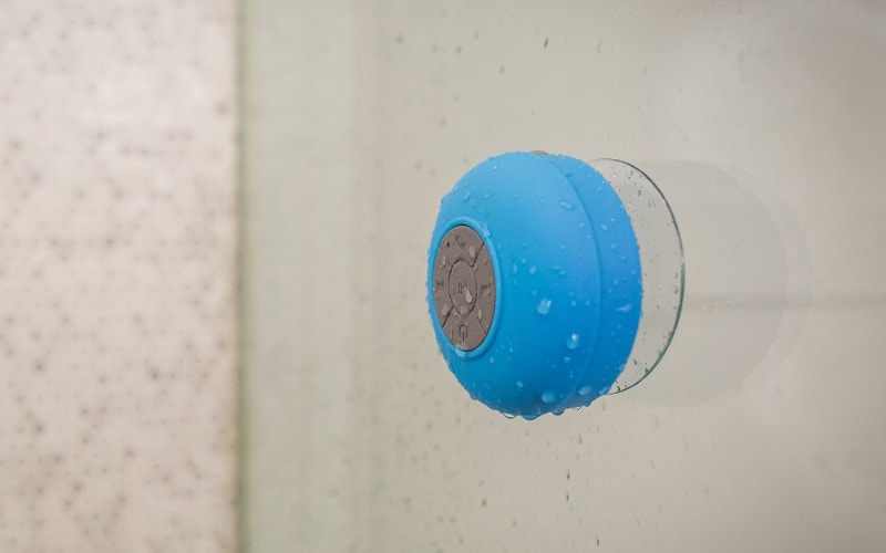 waterproof bluetooth speaker attached to glass with suction