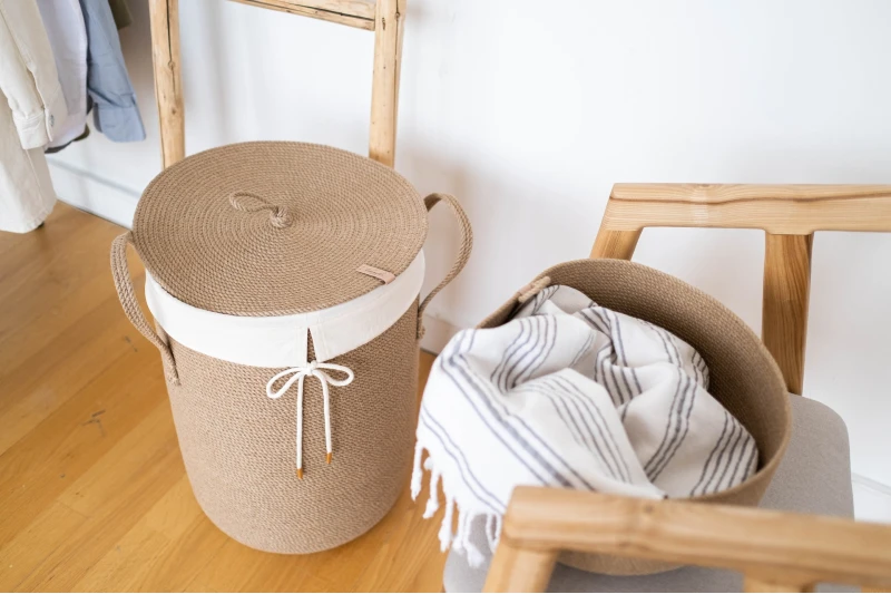white and brown woven laundry basket