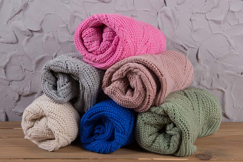 six colored woolen sweater rolled
