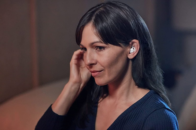 woman wearing ear plugs