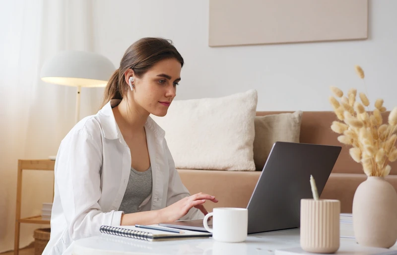 woman using her laptop in the living room