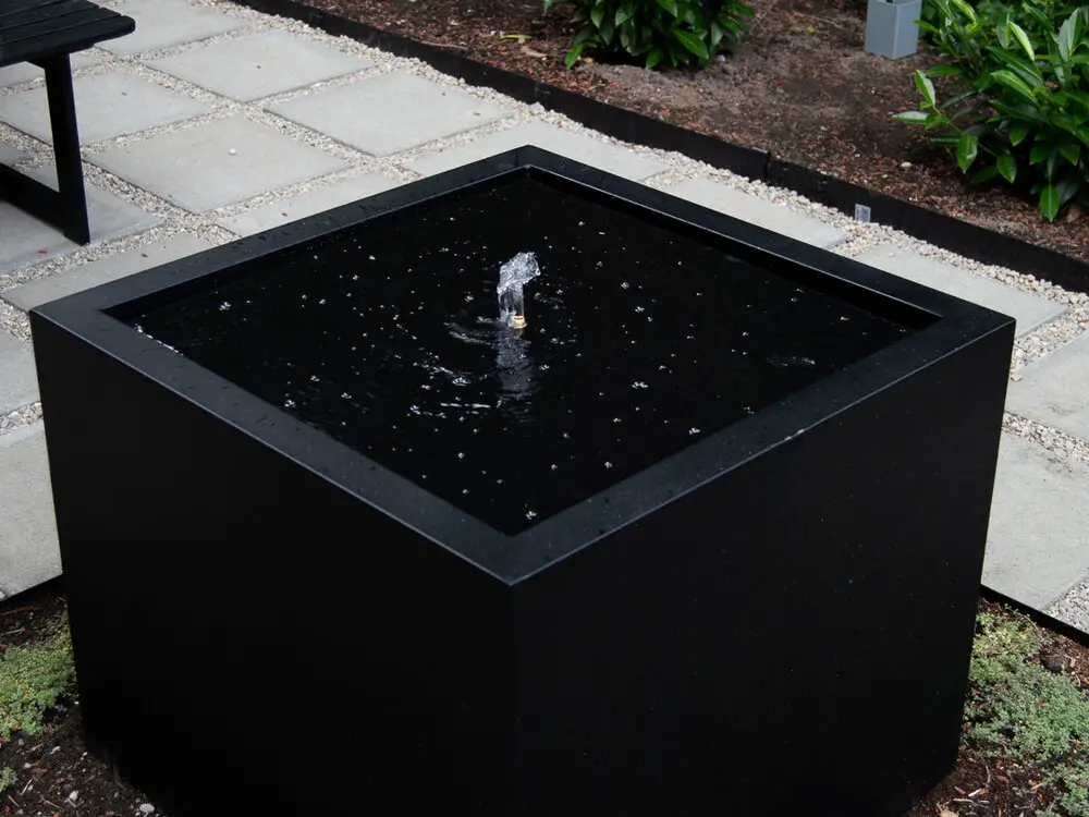 Modern Feature Fountain from a Planter Box by the savvy heart