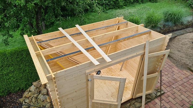 Garden shed built from tree trunks