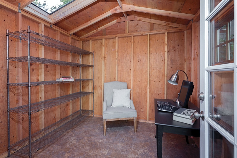 Inside of a wooden Garden Shed used as home office