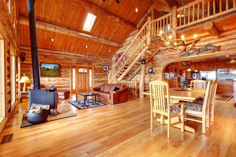 Large luxury log house living room with staircase