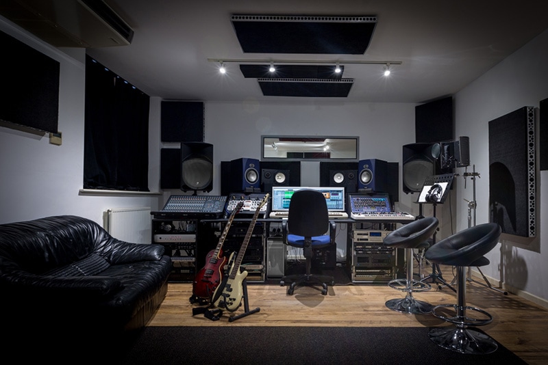 Recording studio control room complete with mixing desk, computer and outboard equipment