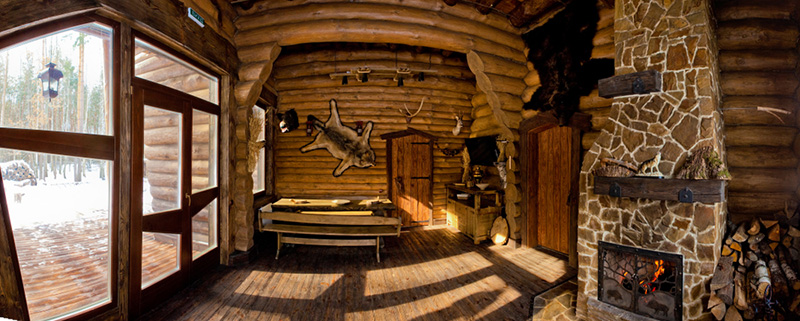 ountry style interior in hunter chalet with fireplace