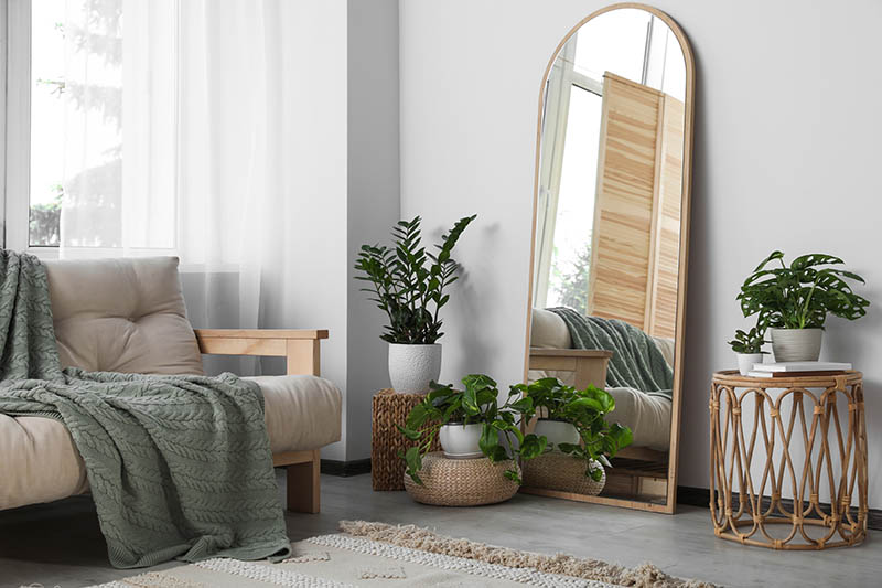 Beautiful room interior with leaning floor mirror