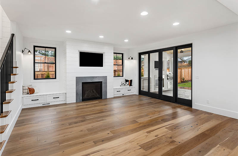 Beautiful white farmhouse style living room in new luxury home