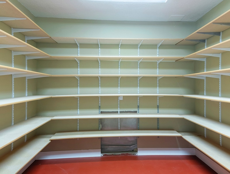 Square frame Interior of a food storage room with empty shelves at the basement