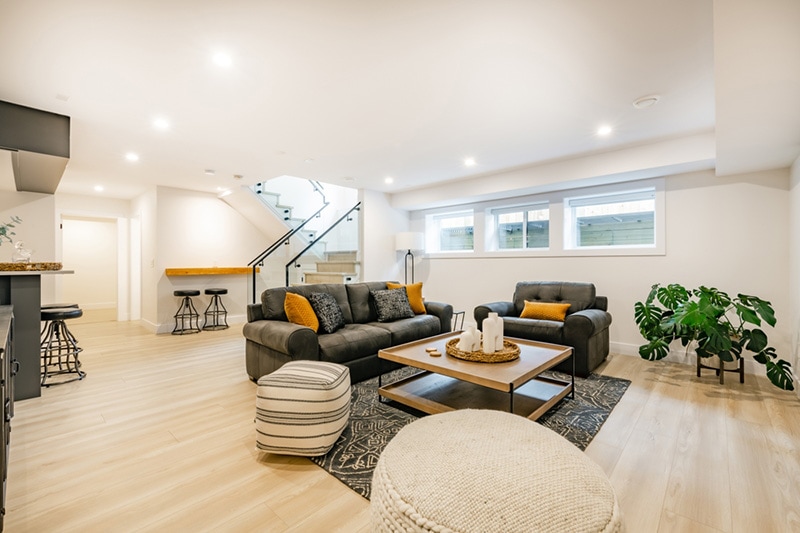 recreation party room with bar stairs with glass rails downstairs basement interior room